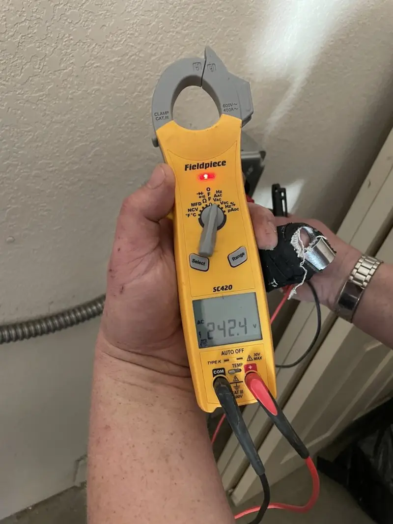 Voltage testing with clamp meter during Outlet Installation in Flemingsburg